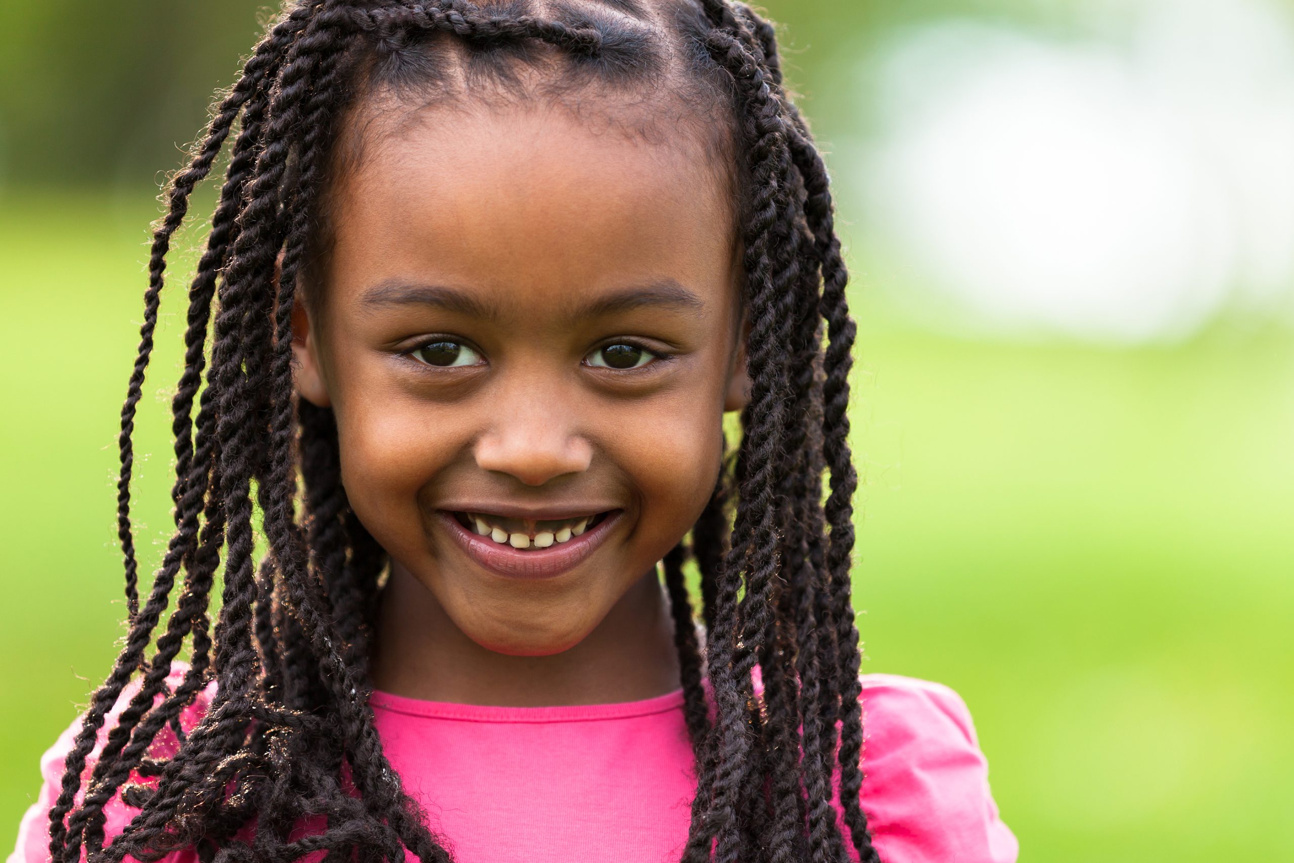 Joyul little African American girl, smiling