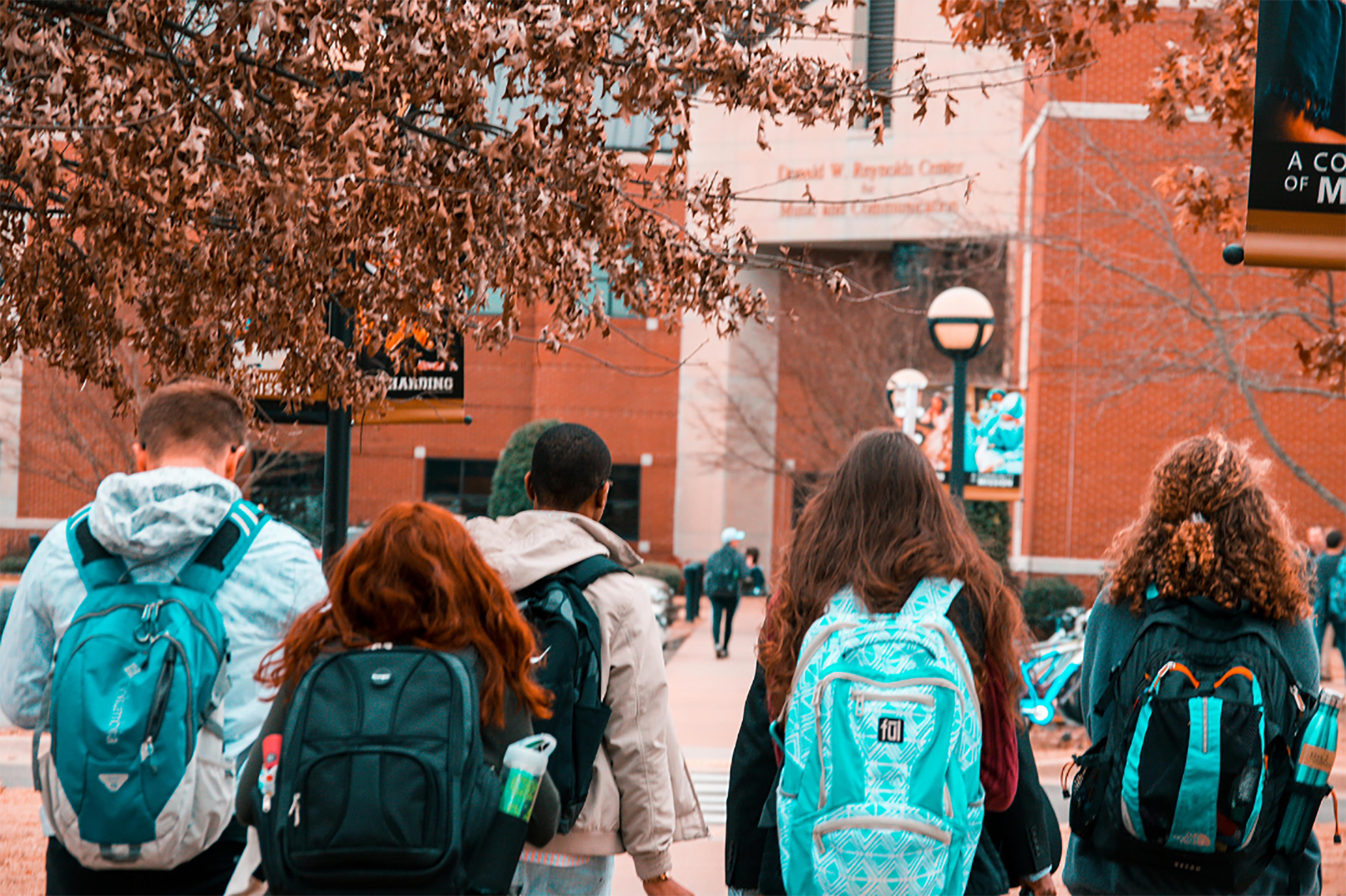 children walking into school building