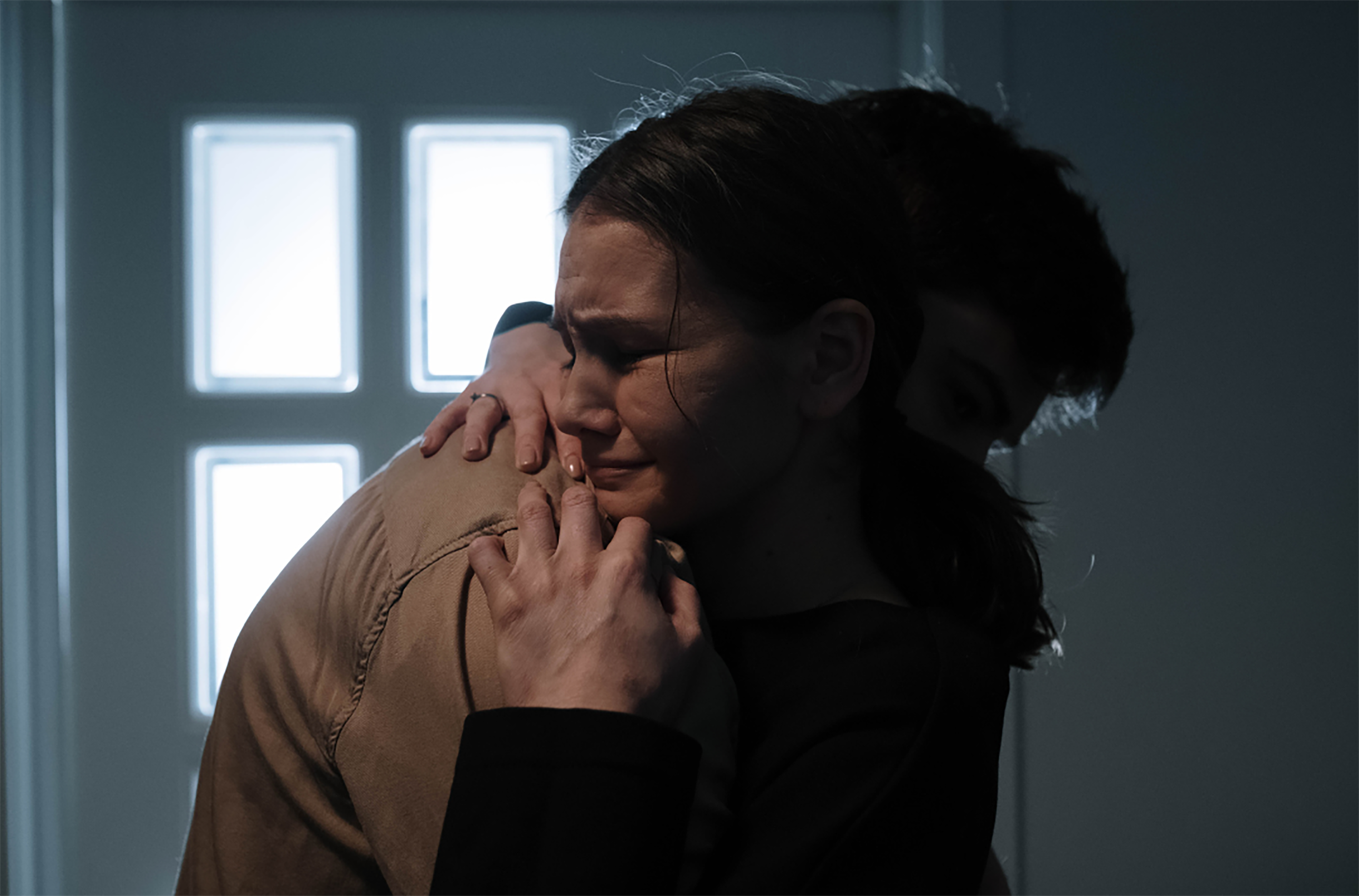 man and woman hugging