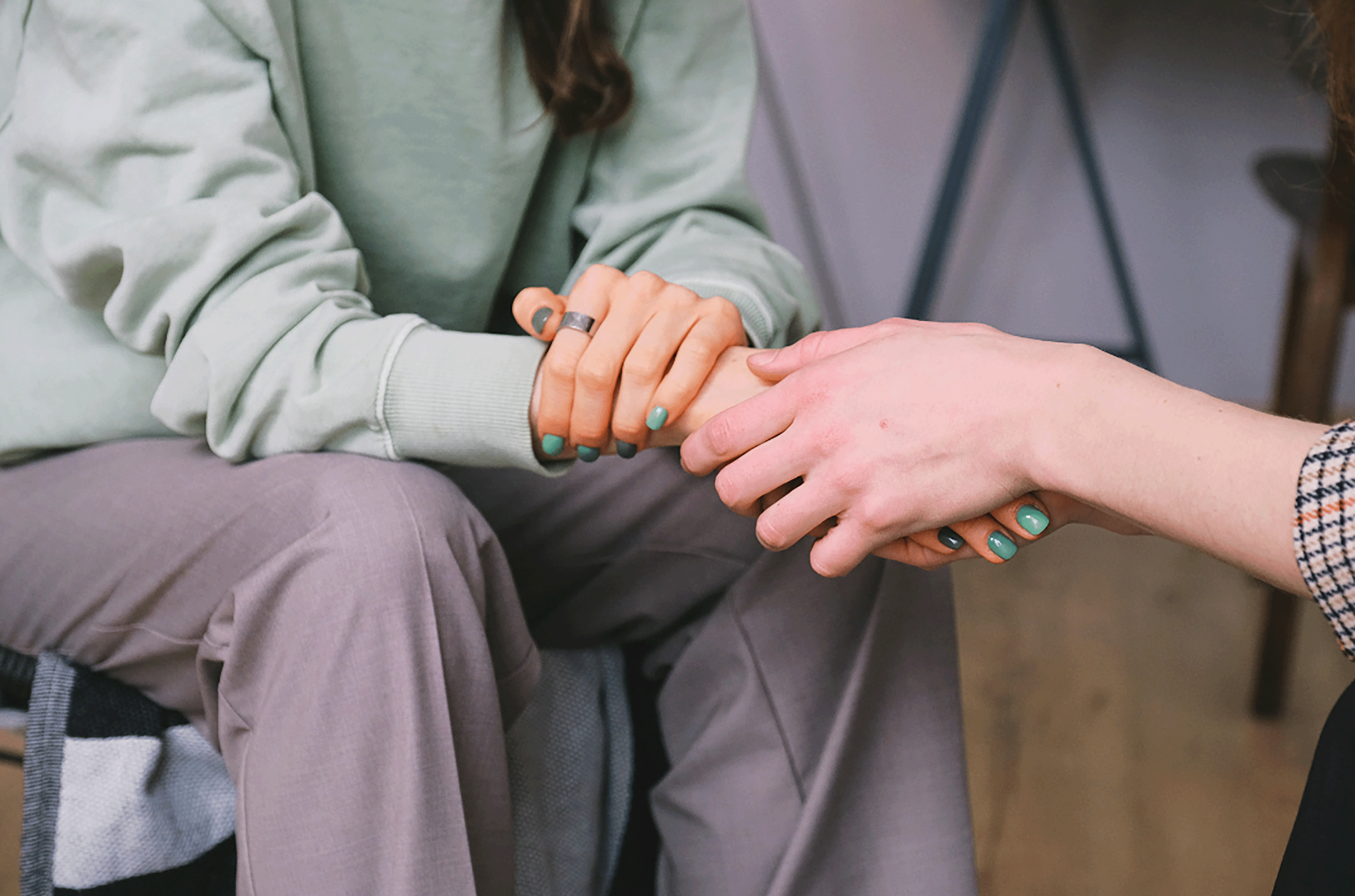 two people holding hands