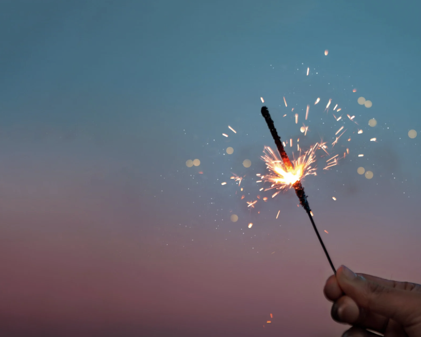 person holding sparkler