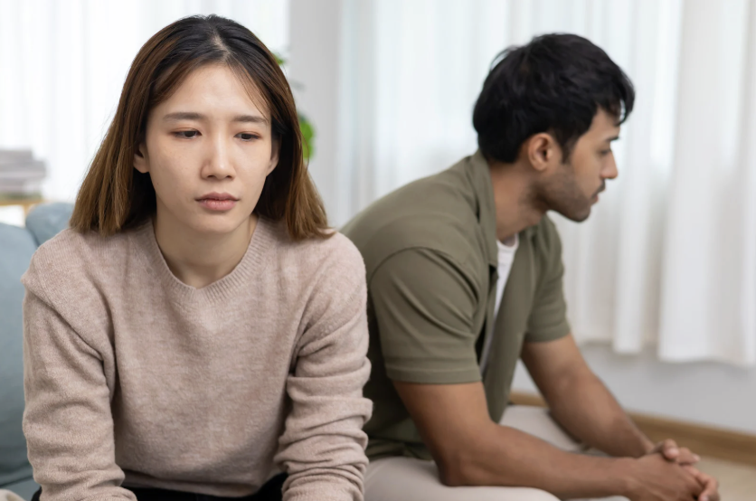 woman and man facing away from each other
